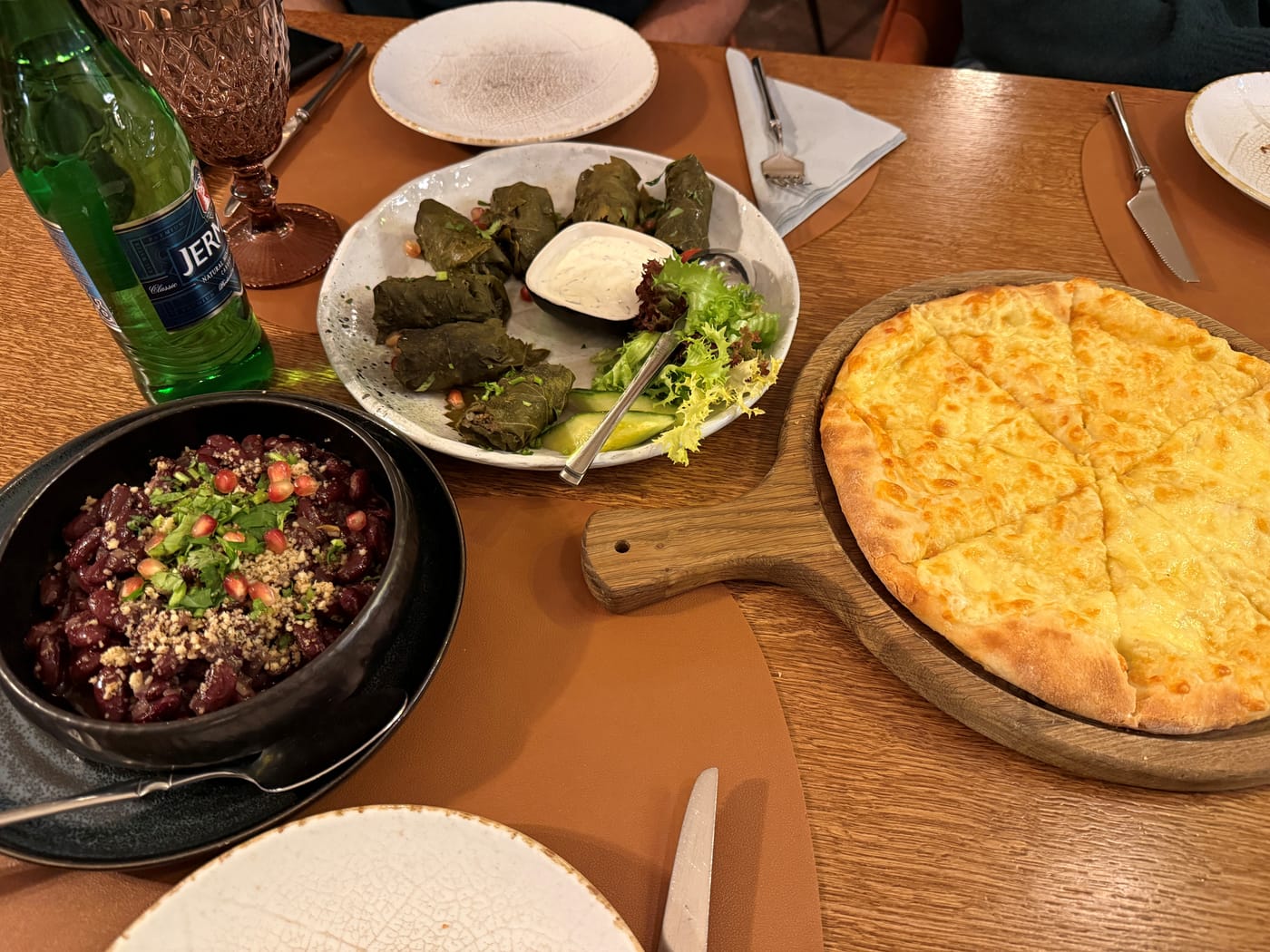 A Georgian spread of red bean lobio, stuffed vine leaves and khachapuri at a Riga restaurant